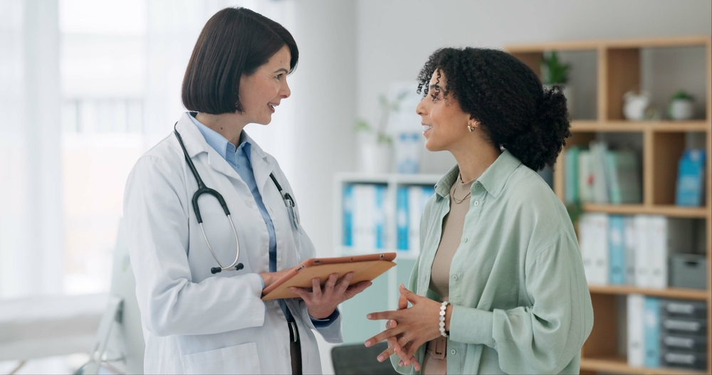 doctor explaining fertility after abortion to a female patient