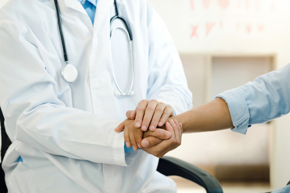 doctor comforting patient in need of D&C procedure after miscarriage