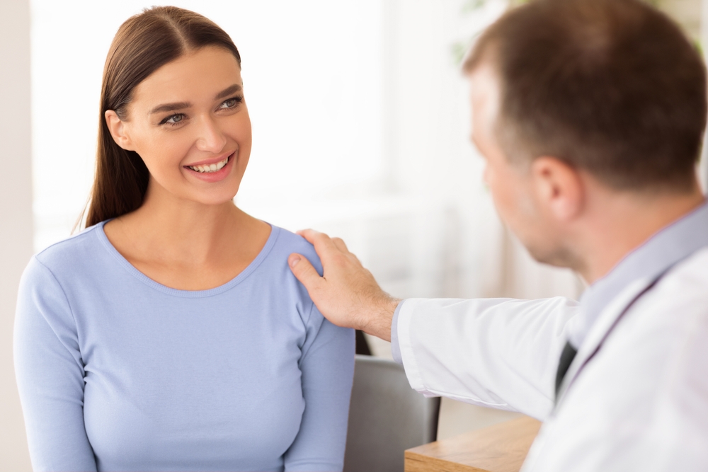 doctor comforting patient before a D&C in Brooklyn