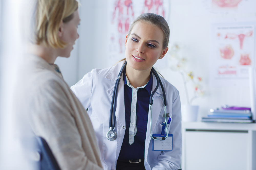 woman asking doctor when she can use a tampon after an abortion