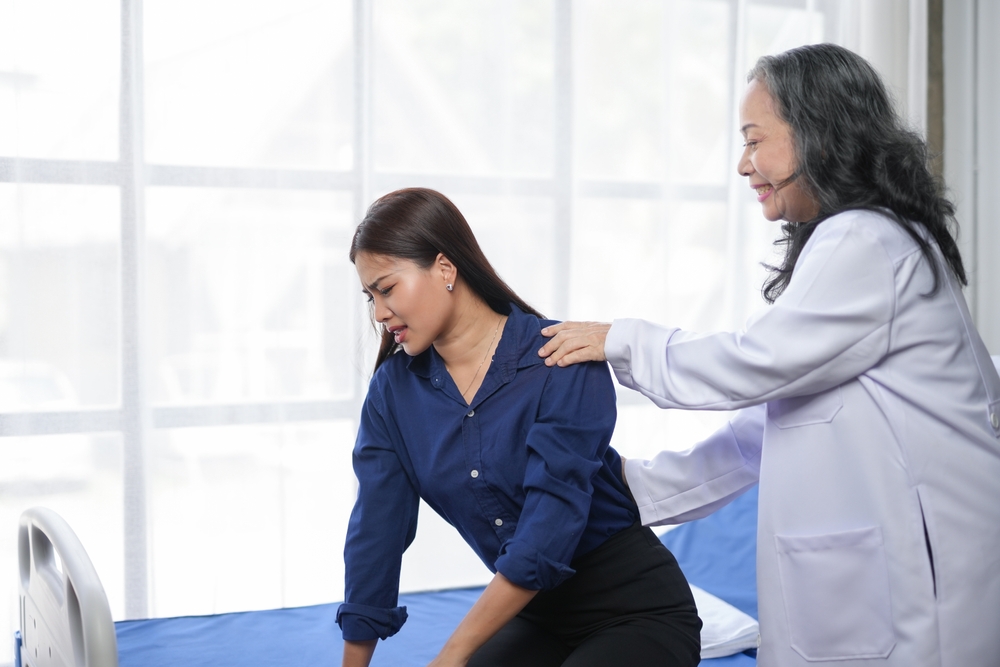 woman with low back pain after an abortion in NJ