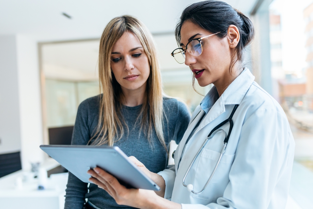 doctor and patient discussing womb damage after an abortion