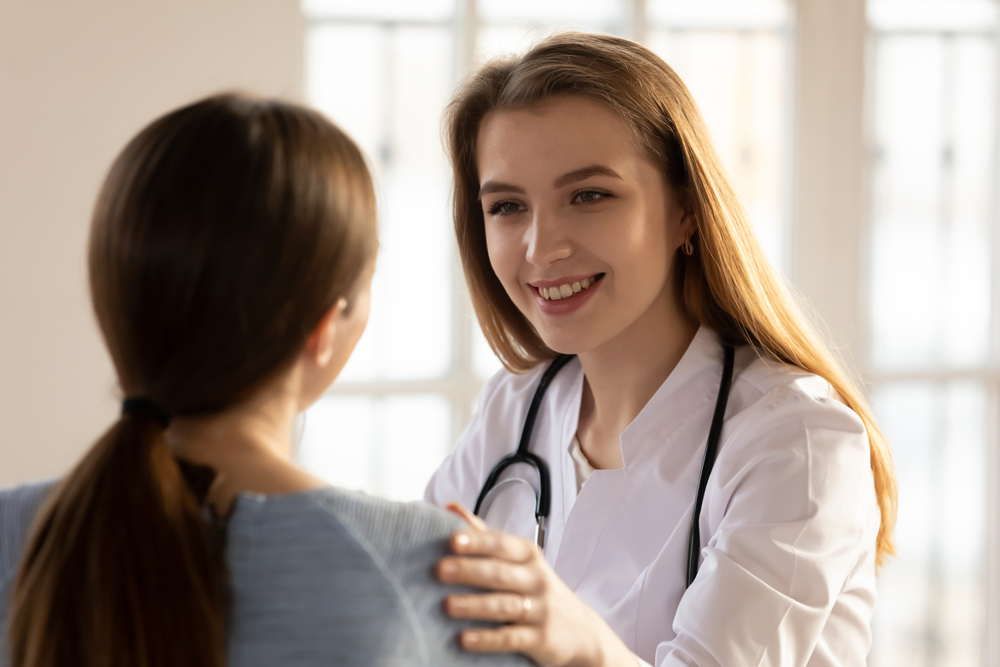 woman comforted after traveling to New Jersey for an abortion